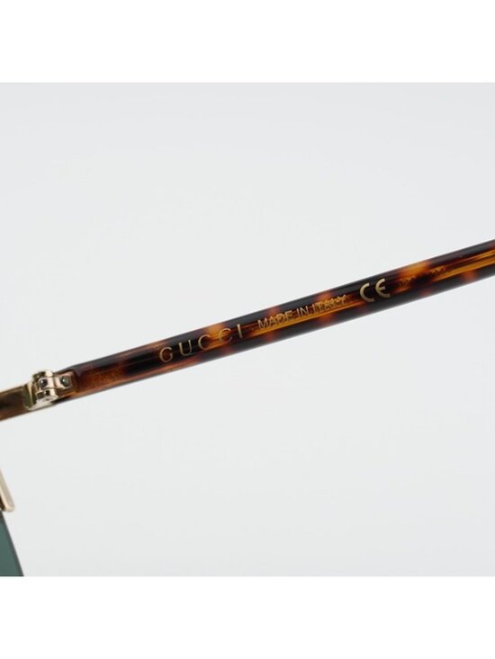 Gucci GG0584S 002 Sunglasses Gold Shield Frame, Green Lenses